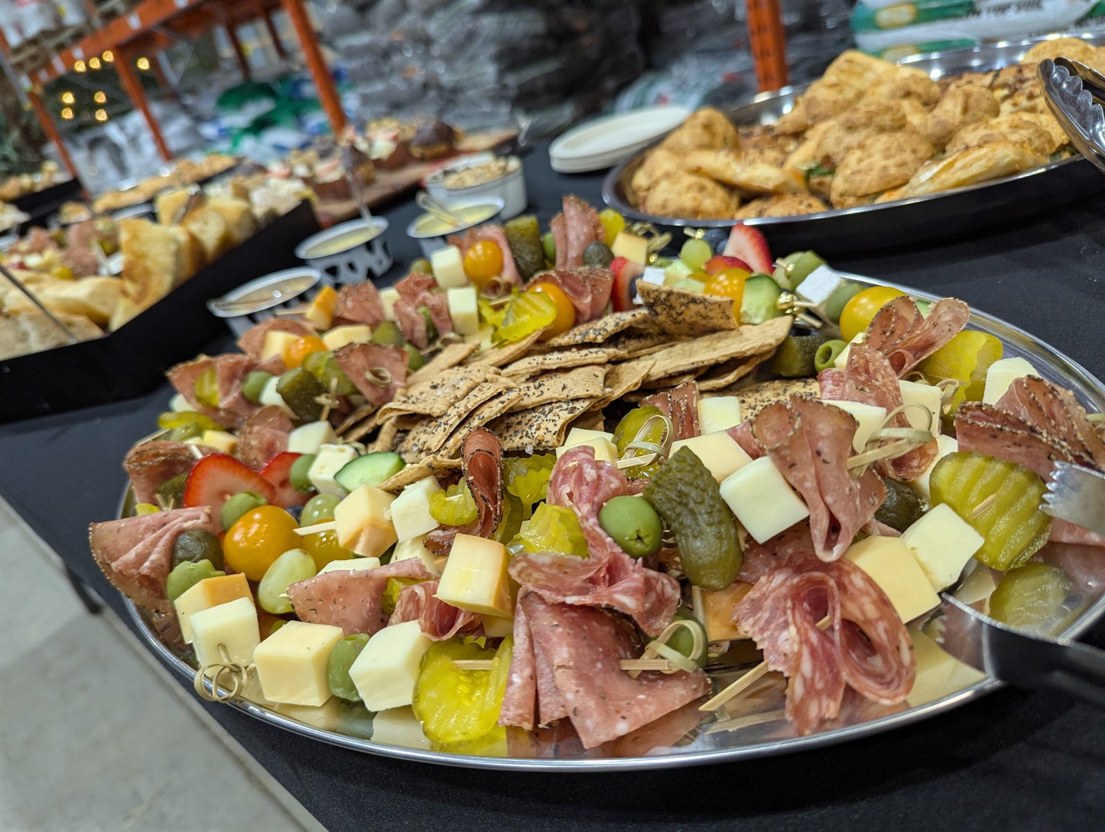 Charcuterie, cheese, fruit, and vegetables arranged for a catered event