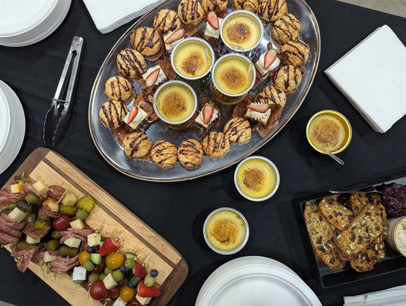 Small desserts and custards arranged for a catered gathering